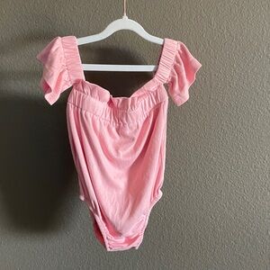 Baileys Blossoms Ruffled Pink Off-Shoulder Bodysuit with a faux suede look.👀